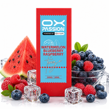 A red rectangular OX PASSION vape product box labeled Watermelon Blueberry Raspberry, surrounded by fresh watermelon slices, blueberries, raspberries, mint leaves, and clear ice cubes on a white background.