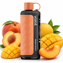 A Vozol Mango Peach disposable vape device stands upright in the center, surrounded by fresh mangoes and peaches on a clean white background. The vape has a matte black body with a prominent copper-orange textured panel and matching copper-orange cap.