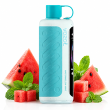 A Vozol Watermelon Mint disposable vape device with a translucent white body, a bright turquoise blue grip and cap, and a black side panel, styled with fresh watermelon slices and mint leaves on a white background.